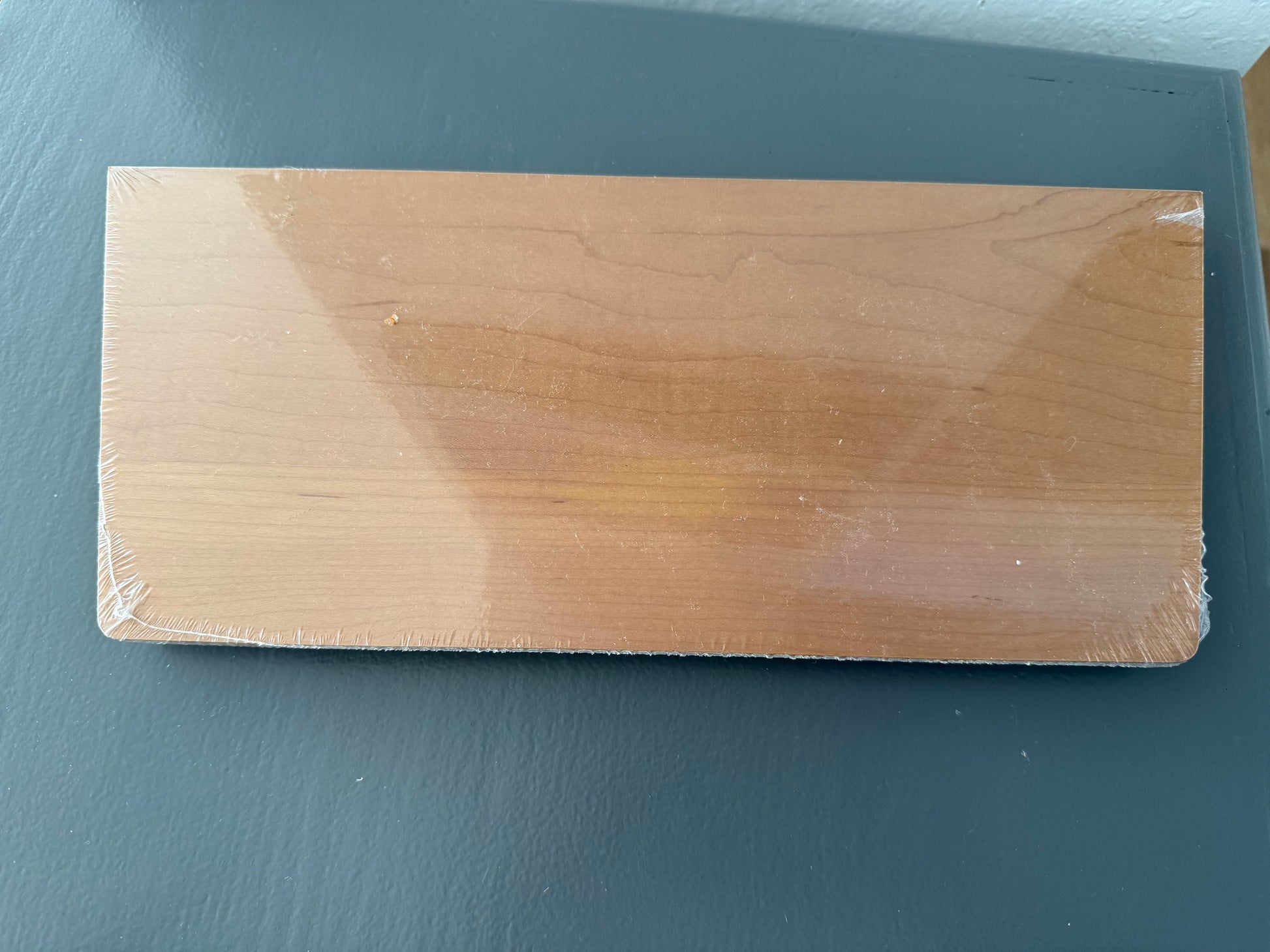 Wooden block on a dark gray surface