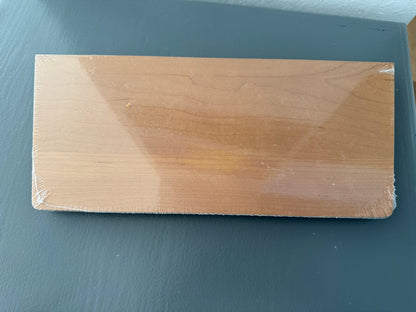 Wooden block on a dark gray surface