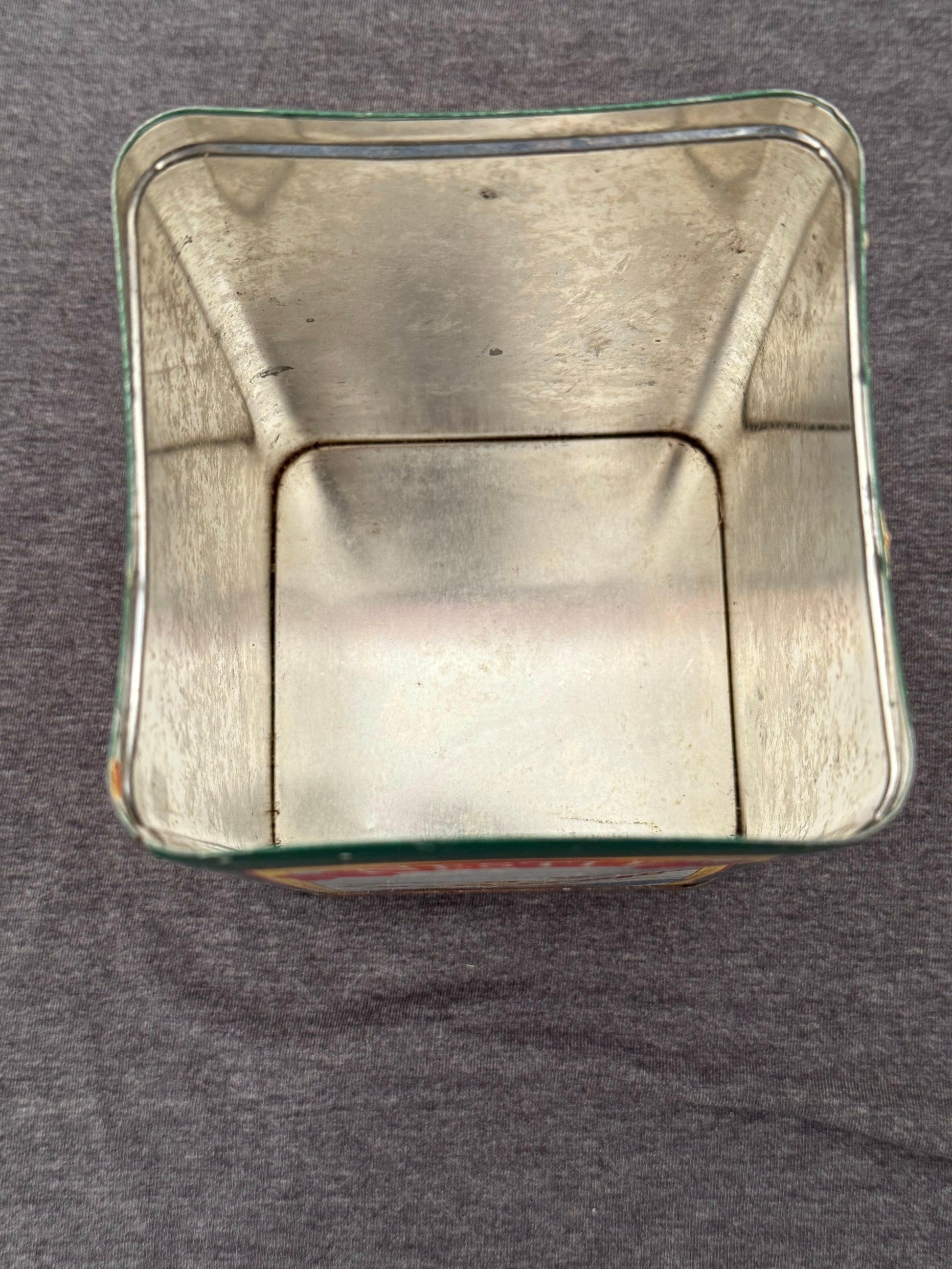 Metallic square object on a gray background