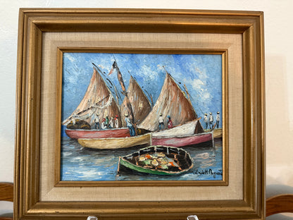 Framed painting of sailboats on a blue sky background