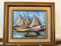Framed painting of sailboats on a blue sky background