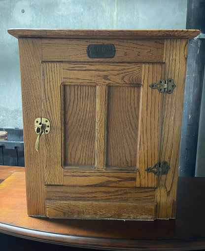 Wooden White Clad cabinet with a lock on a wooden surface