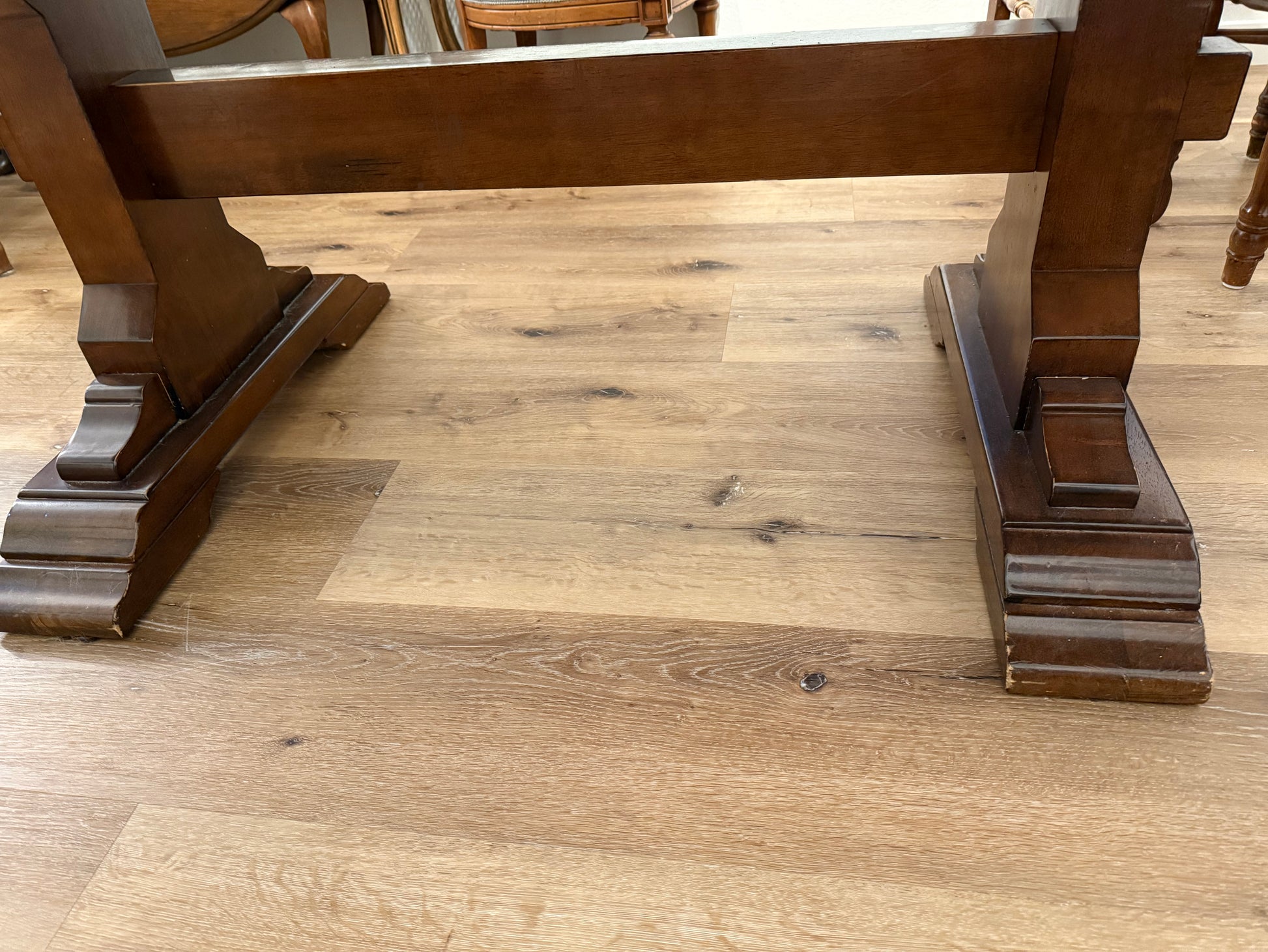 Wooden table base on a wooden floor