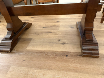 Wooden table base on a wooden floor