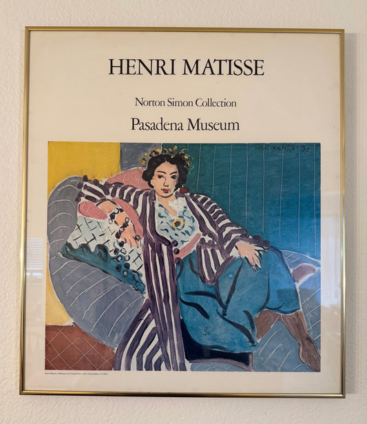 Framed Henri Matisse artwork at the Pasadena Museum, featuring a woman in a striped dress.