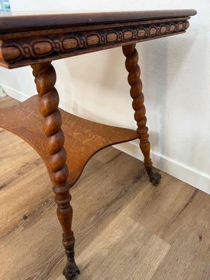 Wooden side table with spiral legs on a wooden floor