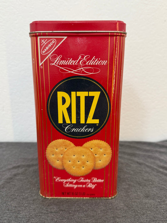 Red Ritz crackers tin on a white and gray surface