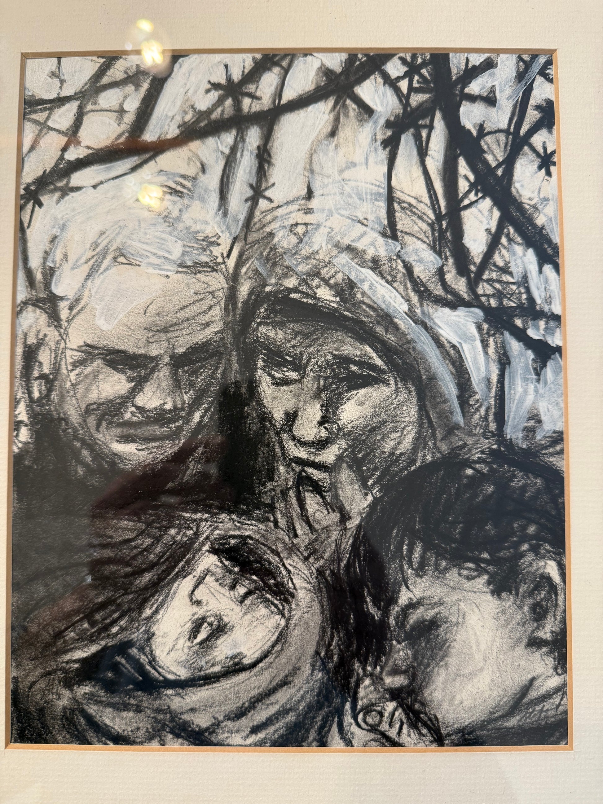 Artistic depiction of a people lying on the ground with trees in the background