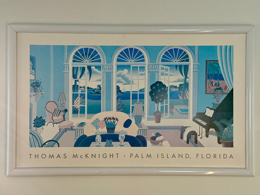 Framed artwork of a room with large windows, furniture, and decor.