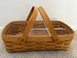Wooden picnic basket with clear compartments on a white background