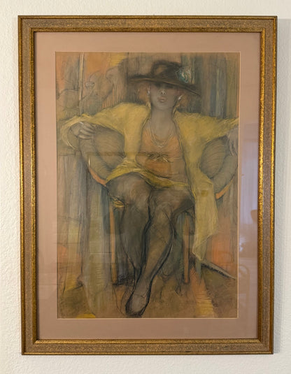 Framed artwork of a woman sitting on a chair with a yellow garment.