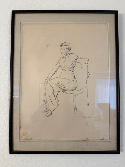 Framed black and white line drawing of a person on a white wall