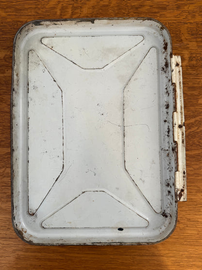 Rust-covered metal tin on a wooden surface