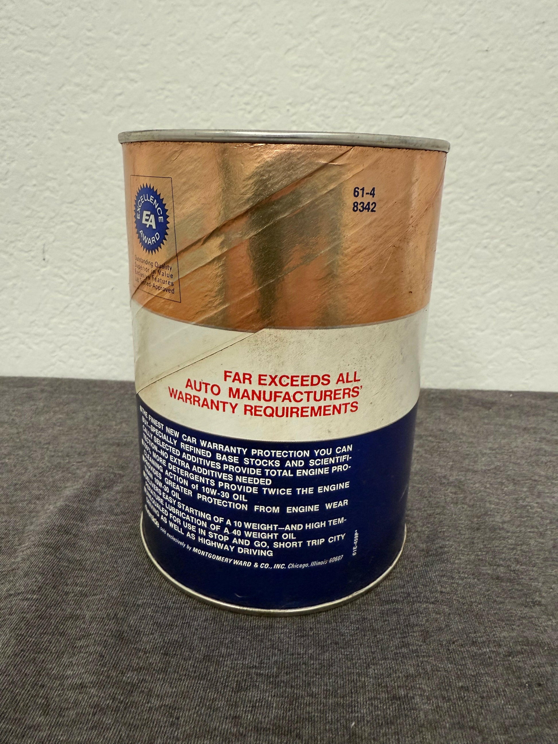 Cylindrical container with wooden side and text on a gray surface